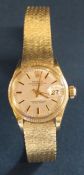 Lady's 18ct gold Rolex Oyster Perpetual Datejust wristwatch on 18ct gold Rolex bracelet strap (