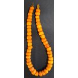 Butterscotch / egg yolk amber bead necklace 43.7g, 44 beads, overall length 38.5cm
