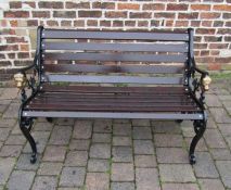 Wooden bench with cast iron lion head bench ends