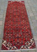 Red ground full pile Persian Hamadan runner 2.6m by 0.8m