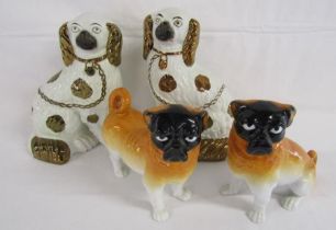 2 Staffordshire style black faced pug dogs and 2 small fireside spaniels approx. 24cm tall