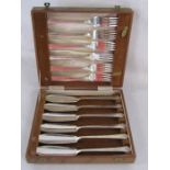 Cased fish knife and fork set and silver plated boiled egg cruet for six