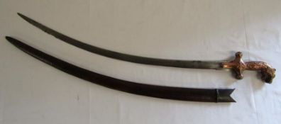 Sabre with tigers head handle and leather scabbard - blade measures approx. 74cm