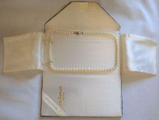 Mikimoto string of graduated pearls in a Lane Crawford Hong Kong wallet, length 47cm, weight 22.98g,