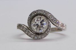 Art Deco platinum ring set with central solitaire diamond (approx. 0.75ct) framed by diamond set