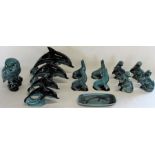 Selection of Poole animal figures, including graduating dolphins and dish, seals, otters and owl