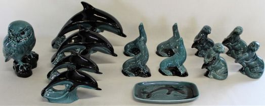 Selection of Poole animal figures, including graduating dolphins and dish, seals, otters and owl