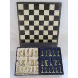Marble chess pieces with marble covered board