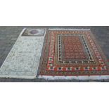 Persian style carpet with stag & stallion motifs 148cm by 205cm, ivory ground runner & a prayer mat