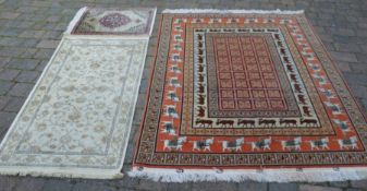 Persian style carpet with stag & stallion motifs 148cm by 205cm, ivory ground runner & a prayer mat