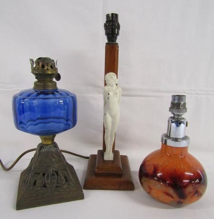 Wooden 1930's table lamp with cast girl holding a ball, cast metal oil lamp with blue glass