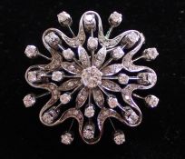 18ct white gold diamond set brooch (marked 750) with central stone approx. 0.40ct, total approx. 1.