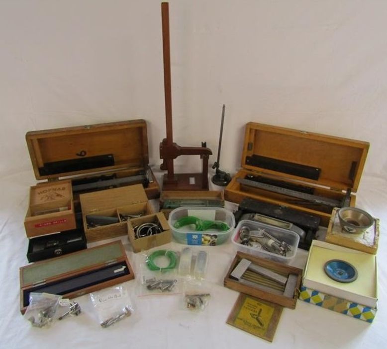 Collection of watchmakers items includes Tokyo glass measure, digital gauge, mainspring winder,