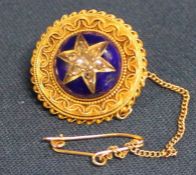 Victorian target brooch with central diamond set star in blue enamel (tested as 15ct gold) 6.8g -