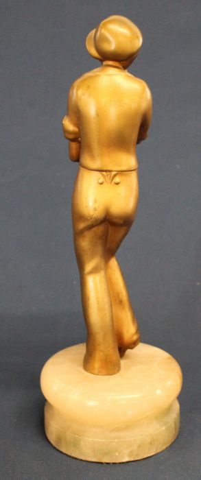 Art Deco c1930 gilt metal figure of whistling female in a cap on onyx socle base 31cm high - Image 3 of 3