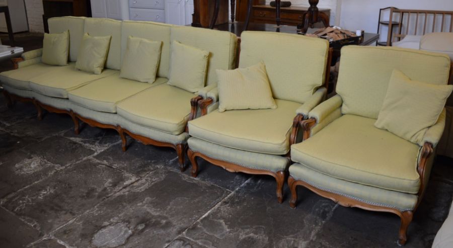 Large French walnut sofa (Length 250cm) & two armchairs all with cushion seating & an open armchair