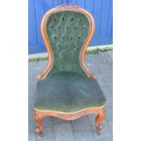 Victorian button back nursing chair in walnut on scroll legs with castors