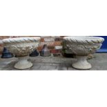 Pair of large concrete urns with acanthus leaves