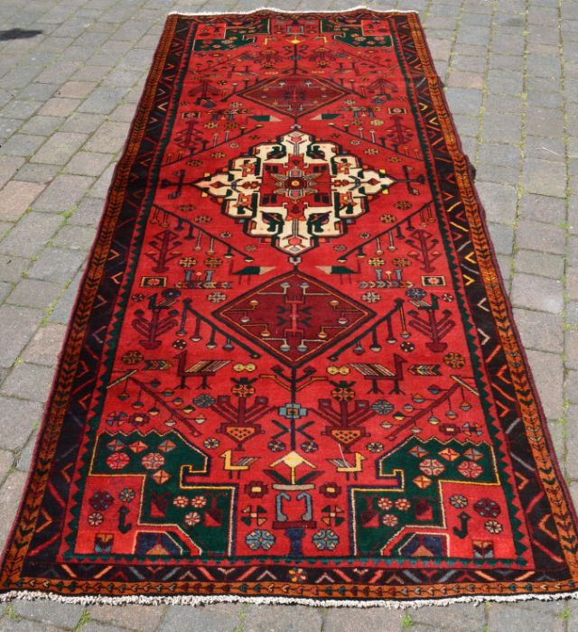 Rich red ground & emerald green full pile Persian lori carpet 310cm by 126cm