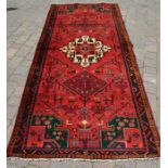 Rich red ground & emerald green full pile Persian lori carpet 310cm by 126cm