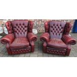 Pair of red leather chesterfield armchairs