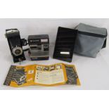 Six-20 Folding Brownie with Dakon shutter camera, Polaroid Sun 600 LMS and Amazon Kindle fire 7 (5th