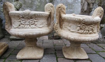 Pair of concrete twin handled urns