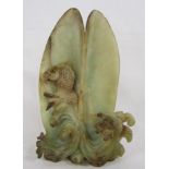 Carved fish resting in a shell possibly jade - approx. 23.5cm tall