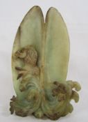 Carved fish resting in a shell possibly jade - approx. 23.5cm tall