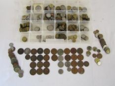 Collection of coins includes pennies, half pennies, foreign coins - possibly some tokens