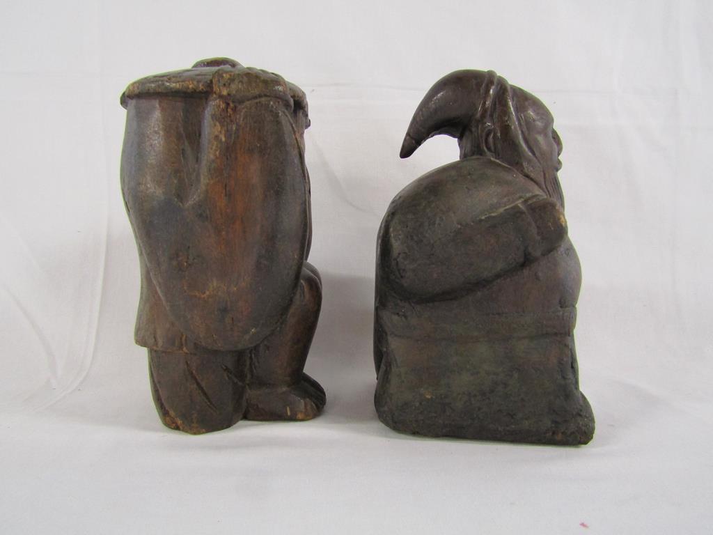 Two wooden carved figures - one possibly Santa carrying a sack and the other of a lady holding her - Image 4 of 4