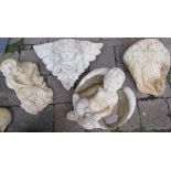 Selection of decorative concrete garden items:- Bacchus cherub lying on a bed of grapes, Cherub's