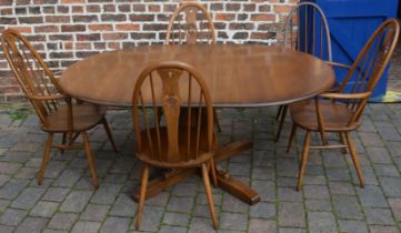 Ercol table with 2 swan back carvers and matching chairs and darker wood Quaker chair