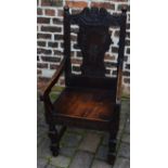 Reproduction 17th century wainscot carved oak chair with loose cushion seat