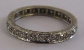 18ct white gold eternity ring set with diamonds - patterned band marked C & F - ring size L -