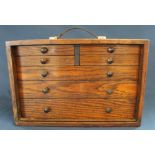 Set of oak miniature watchmakers drawers / cabinet with carrying handle, 43cm w x 21cm d x 28.5cm