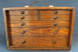 Set of oak miniature watchmakers drawers / cabinet with carrying handle, 43cm w x 21cm d x 28.5cm