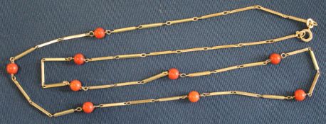 9ct gold necklace interspersed with nine coral beads, 8.33g (30cm drop)