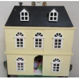 Large dolls house with mixed selection of furniture and dolls