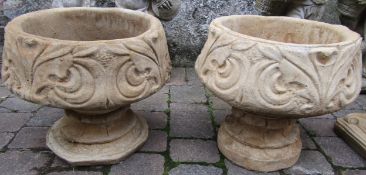 Pair of concrete fleur de lys urns