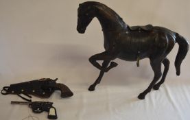 Toy guns and a leather horse