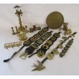 Collection of brass items includes horse brasses, candlesticks, cats, tray with Oriental design also