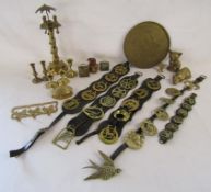 Collection of brass items includes horse brasses, candlesticks, cats, tray with Oriental design also