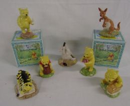 7 Royal Doulton Winnie the Pooh figures - Winnie the Pooh and - the present, the air sized basket,