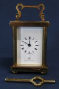 Small brass timepiece carriage clock by Matthew Norman, with Swiss 11 jewels movement & key (