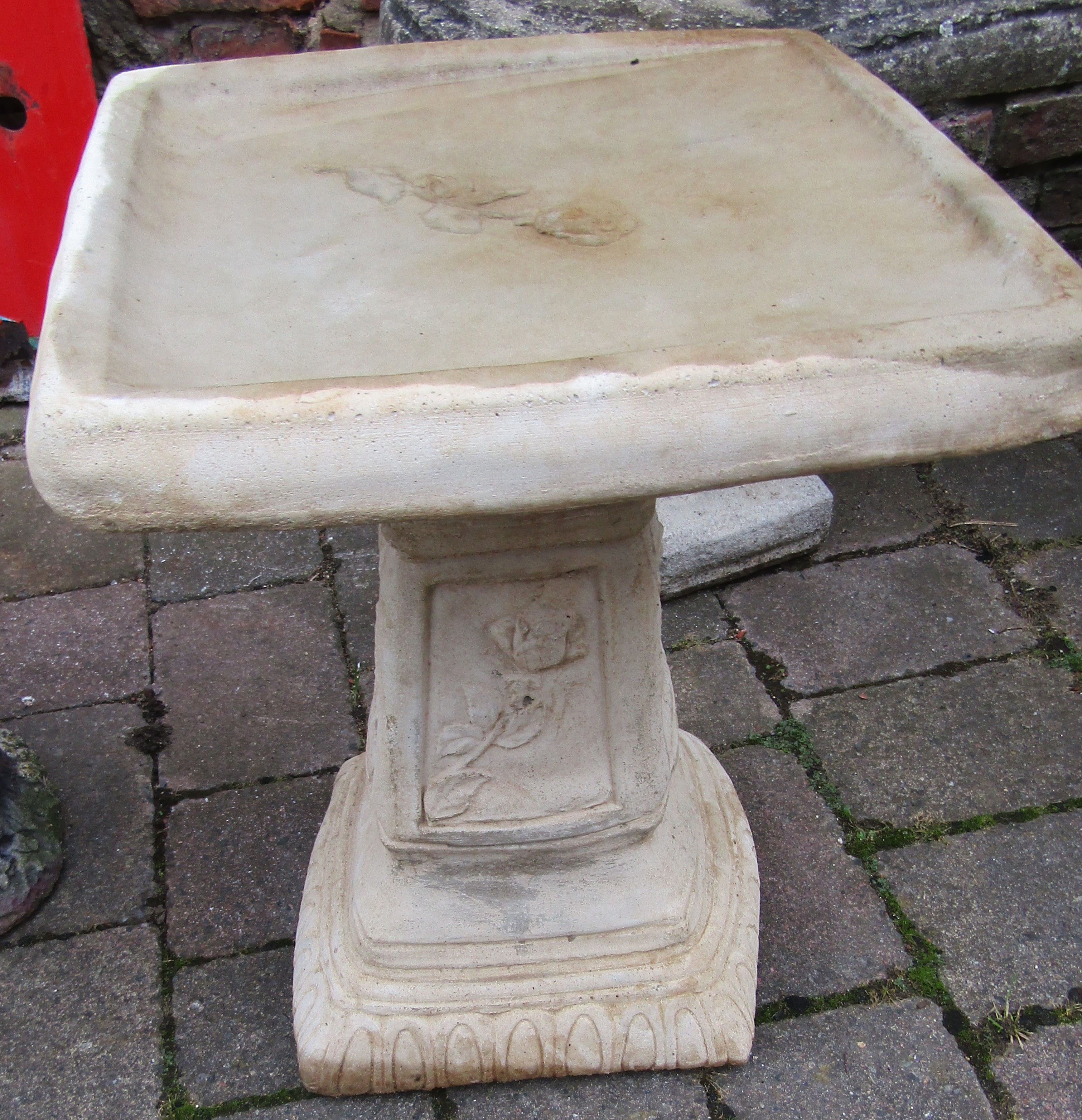 Square concrete bird bath with rose decoration