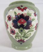 William Moorcroft signed Burslem 348 vase with Persian designs contained in panels on green