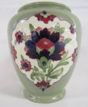 William Moorcroft signed Burslem 348 vase with Persian designs contained in panels on green