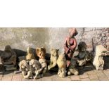 Collection of garden ornaments including Buddha, 3 wise monkeys, etc & a bench support