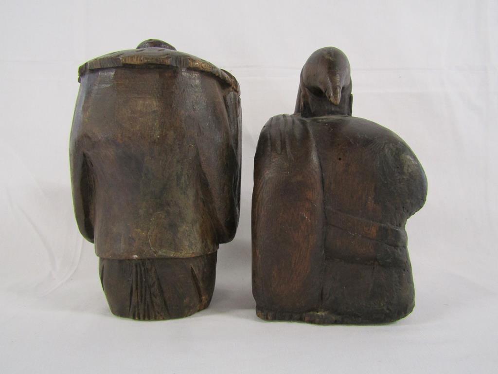 Two wooden carved figures - one possibly Santa carrying a sack and the other of a lady holding her - Image 3 of 4